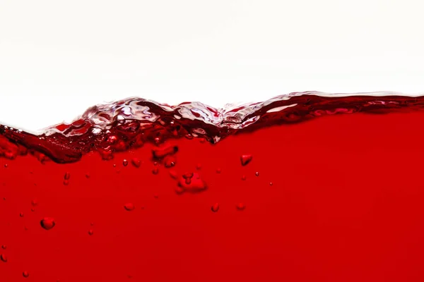 Onda liquida luminosa rossa con bolle isolate su bianco — Foto stock