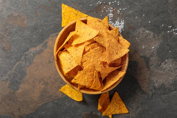 Top view of Mexican nachos with salt on stone table — Stock Photo