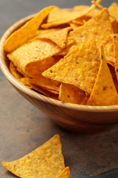 Close up view of Mexican nachos in wooden bowl on stone table — Stock Photo