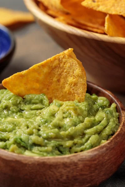 Close up view of delicious Mexican nachos with guacamole — Stock Photo