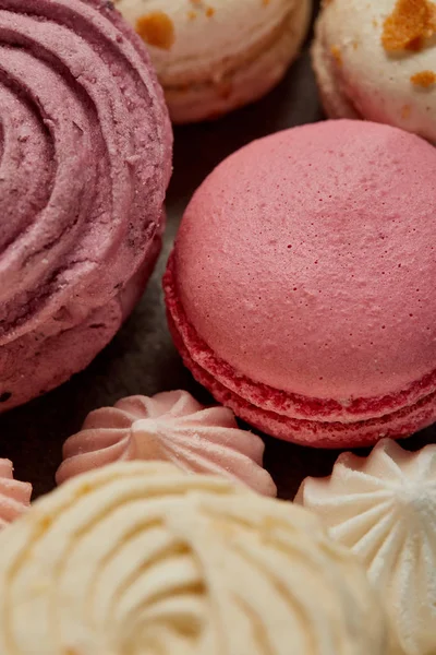 Delicious pink french macaron with soft zephyr and small pink meringues — Stock Photo