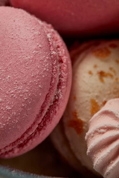 Delicious fresh french macaroons with small pink meringue — Stock Photo