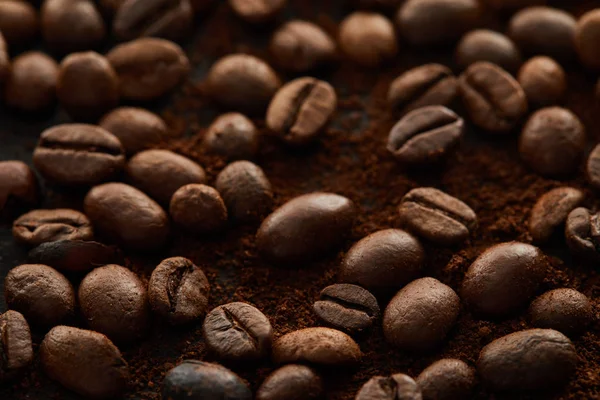 Roasted coffee grains mixed with ground coffee — Stock Photo