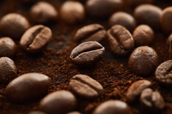 Aromatic brown coffee beans mixed with ground coffee — Stock Photo