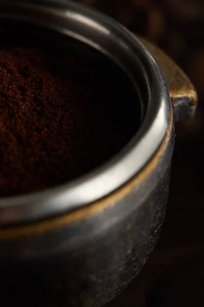 Metallic part of portafilter filled with fresh ground coffee — Stock Photo