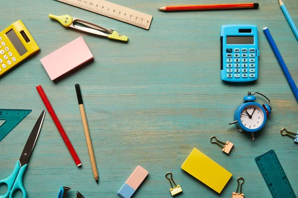 Top view of school supplies at wooden table with copy space — Stock Photo