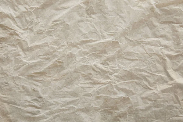 Vista superior de la superficie de papel pergamino abombado beige con espacio de copia - foto de stock