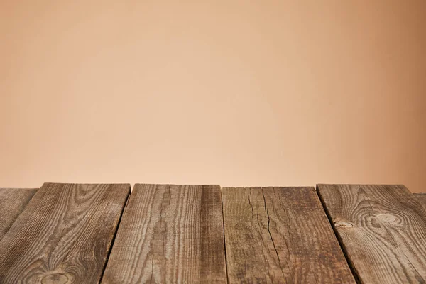 Empty rustic wooden table isolated on brown — Stock Photo