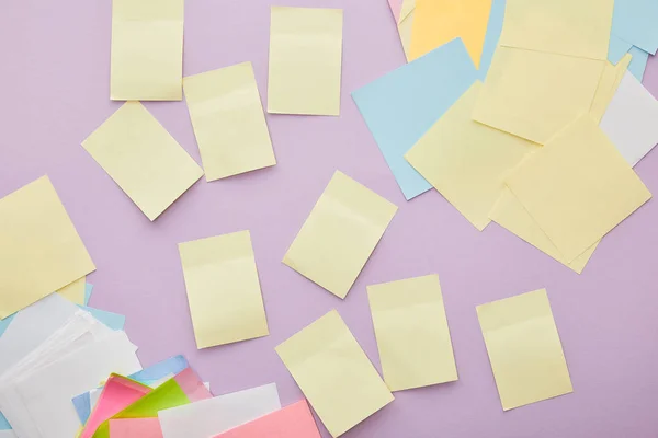 Top view of colorful sticky notes isolated on purple — Stock Photo