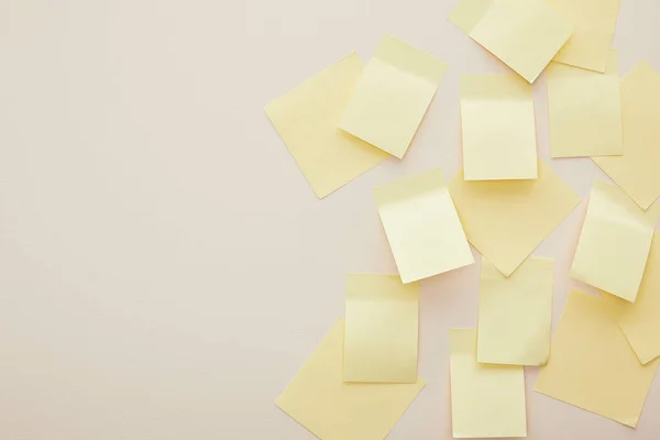 Top view of yellow sticky notes isolated on beige — Stock Photo
