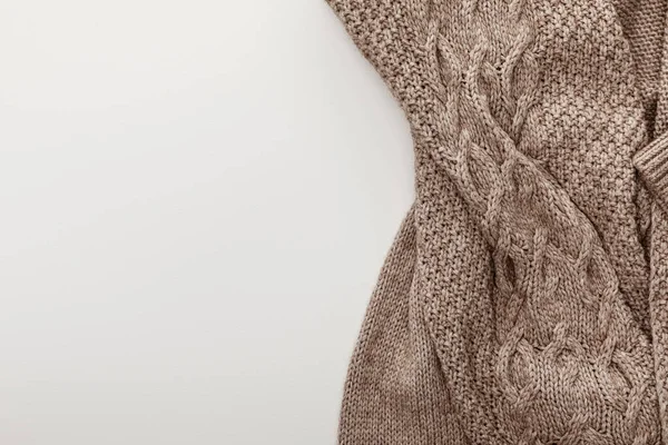 Top view of knitted cozy brown sweater on white background — Stock Photo