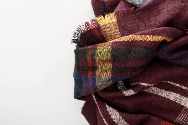 Top view of burgundy wool plaid scarf on white background — Stock Photo