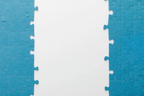 Top view of blue jigsaw puzzle on white background — Stock Photo