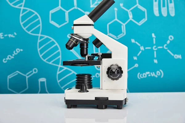Microscope on blue background with molecular structure — Stock Photo