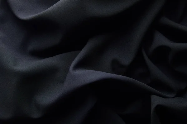 Background of black crumpled textured cloth — Stock Photo