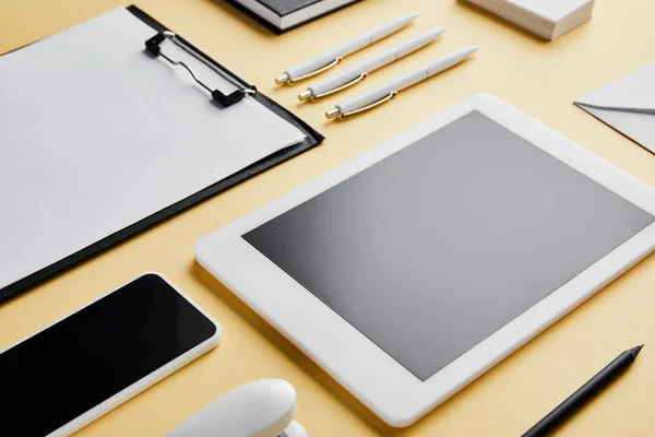Clipboard, pens, pencil, business cards, smartphone and digital tablet with copy space — Stock Photo