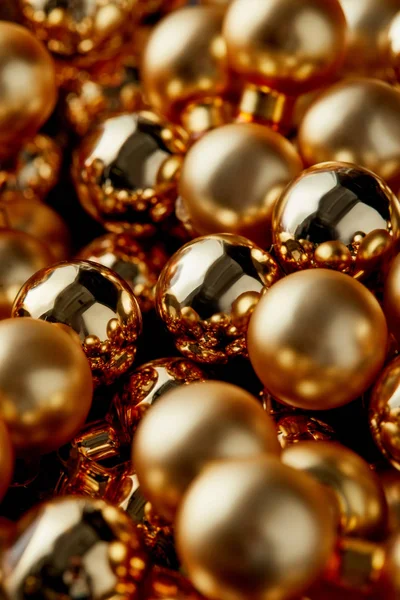 Close up view of shiny golden Christmas baubles — Stock Photo