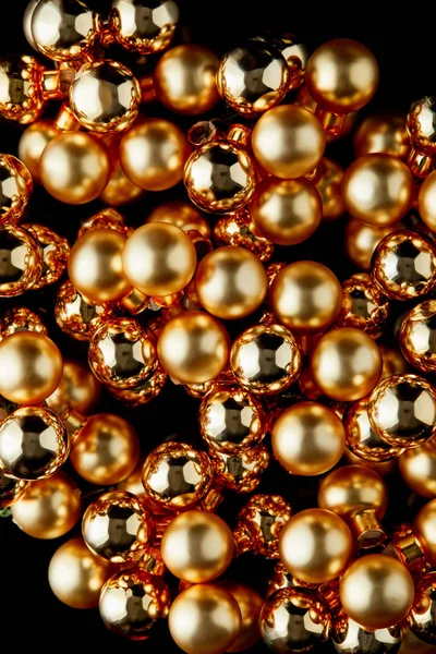 Top view of shiny golden Christmas balls isolated on black — Stock Photo