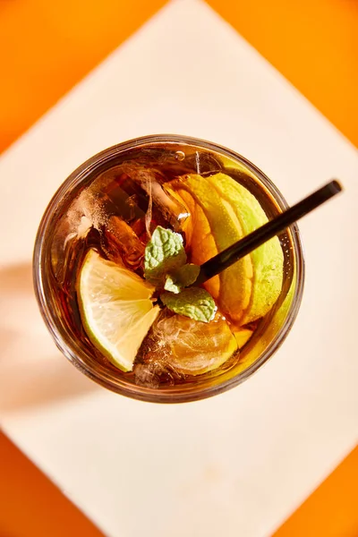 Top view of cocktail cuba libre in glass with straw — Stock Photo