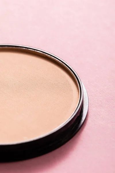 Close up of face powder on pink — Stock Photo