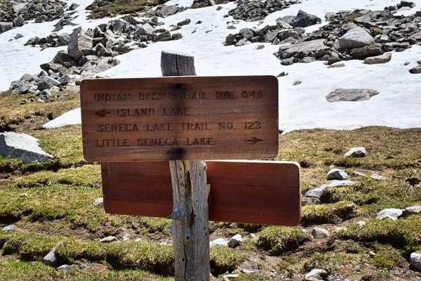 Continental Divide Trail sign post in Wind Rivers Range Wyoming along Continental Divide Trail No. 094, Fremont Crossing, Seneca Lake, Lester Pass, Island Lake and Indian Lake which is part of the Rocky Mountains in the United States.Signage, sign,