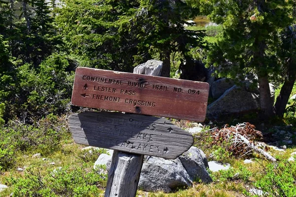Continental Divide Trail sign post in Wind Rivers Range Wyoming along Continental Divide Trail No. 094, Fremont Crossing, Seneca Lake, Lester Pass, Island Lake and Indian Lake which is part of the Rocky Mountains in the United States.Signage, sign,