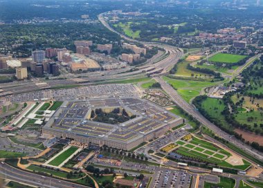 Aerial view of the United States Pentagon, the Department of Defense headquarters in Arlington, Virginia, near Washington DC, with I-395 freeway and the Air Force Memorial and Arlington Cemetery nearby. clipart