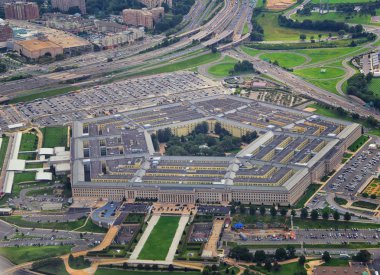 Aerial view of the United States Pentagon, the Department of Defense headquarters in Arlington, Virginia, near Washington DC, with I-395 freeway and the Air Force Memorial and Arlington Cemetery nearby. clipart