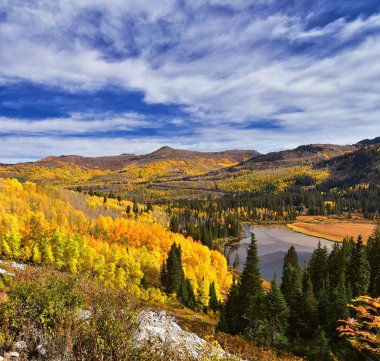 Silver Lake by Solitude and Brighton Ski resort in Big Cottonwood Canyon. Panoramic Views from the hiking and boardwalk trails of the surrounding mountains, aspen and pine trees in brilliant fall autumn colors. In the Rocky Mountains, Wasatch Front,  clipart