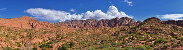 Views of Red Mountain Wilderness and Snow Canyon State Park from the  Millcreek Trail and Washington Hollow by St George, Utah in Spring bloom in desert. United States.