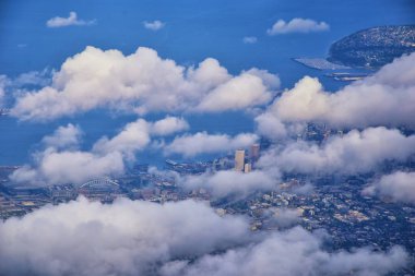 Seattle, Washington, 2019 Cityscape Aerial Panoramic View through cloudscape including Ocean, rivers and rural urban. USA. clipart