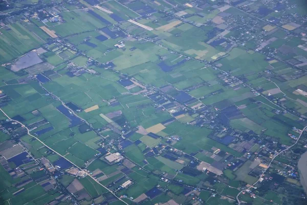 Aerial view of Bangkok Thailand and surrounding landscape, modern office buildings, condominium, living place in Bangkok city downtown in the most populated. Southeast Asia.