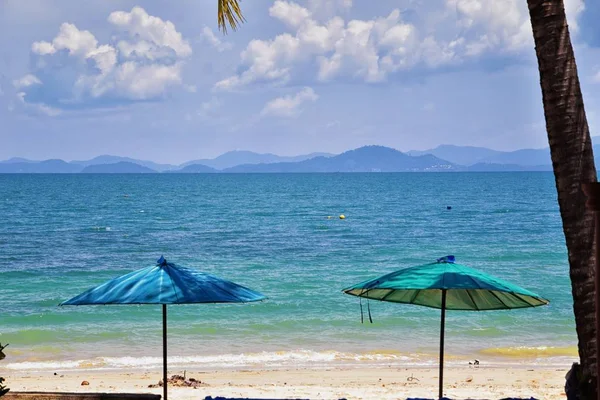 Island, Ocean views near Phuket Thailand with Blues, Turquoise and Greens oceans, mountains, boats, caves, trees resort island of phuket Thailand. Including Phi Phi, Ko Rang Yai, Ko Li Pe and other islands. Asia.