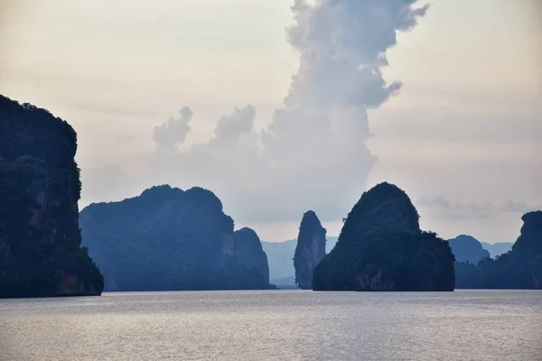 Island, Ocean views near Phuket Thailand with Blues, Turquoise and Greens oceans, mountains, boats, caves, trees resort island of phuket Thailand. Including Phi Phi, Ko Rang Yai, Ko Li Pe and other islands. Asia.