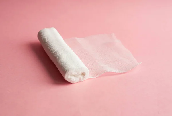 Medical bandage on a pink background — Stock Photo, Image