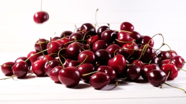 Hands take turns berries on a white isolated background — Stock Video