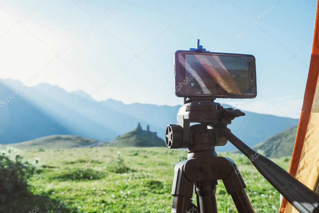 Smart phone on tripod in the caucasian mountains