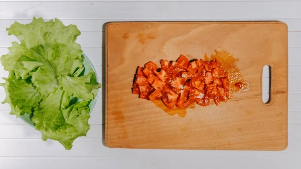Stop motion cooking salad from fresh vegetables, flat lay. Animation top view