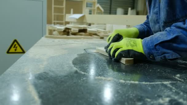 Worker removes chamfer radius cutter in a furniture factory. Manufacture of wooden furniture — Stock Video