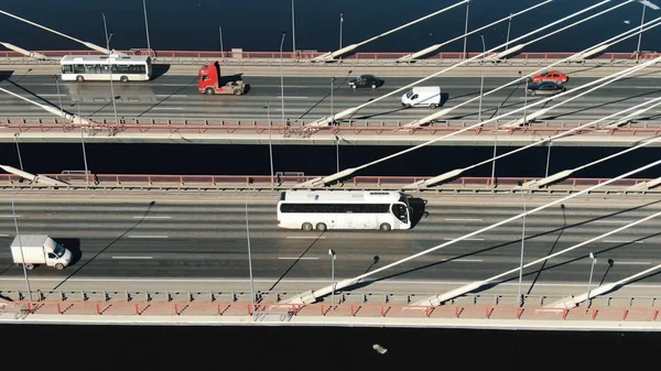 Cars driving on cable-stayed bridge close up, aerial view