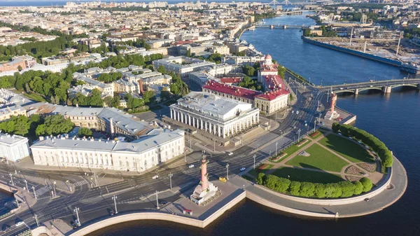 Spit of Vasilyevsky Island. St. Petersburg. Neva River. Summer view of Petersburg. Rastral columns. The Cabinet of Curiosities. The Palace Bridge.