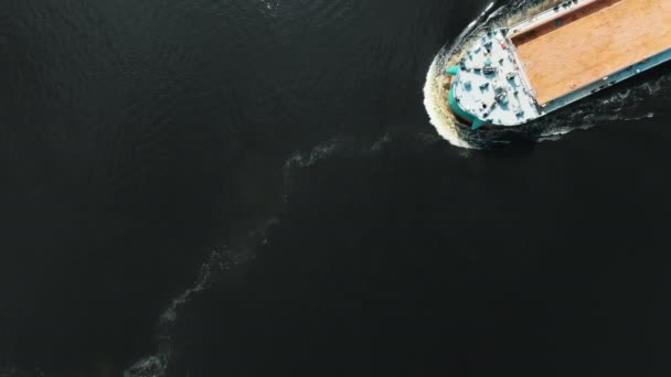 Freight vessel with brown wooden deck on deep ocean water — Stock Video