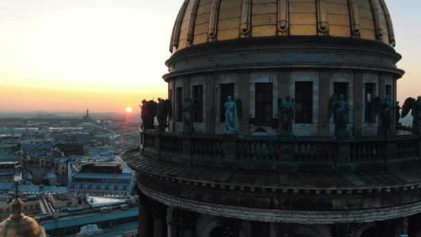 High domed cathedral rises above old capital against sunset — Stock Video