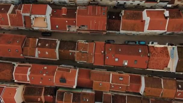 Aerial motion over street old buildings with brown roofs — Stock Video