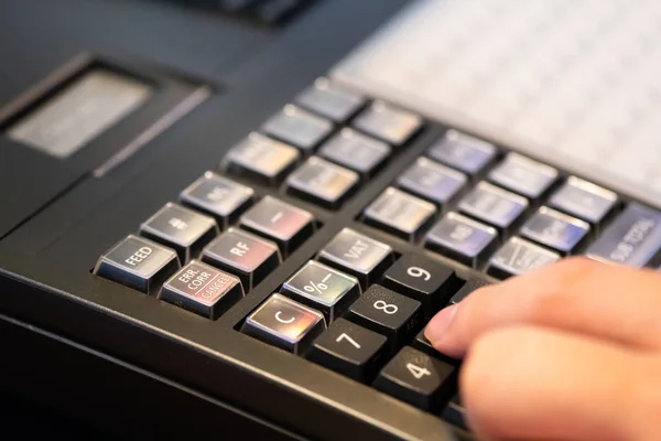 cash register installed on counter for accepting order from cust