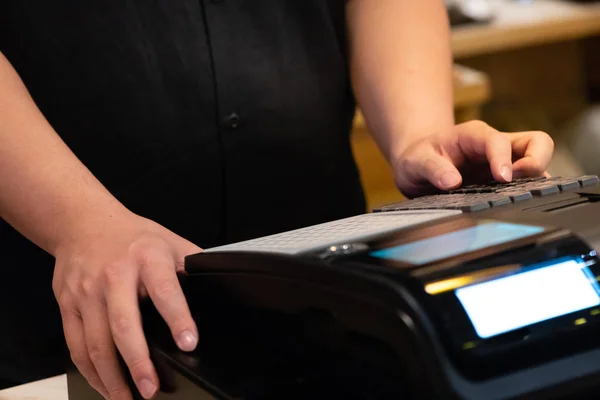 cash register installed on counter for accepting order from cust