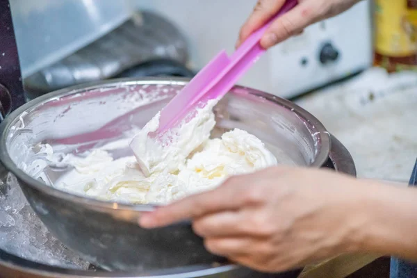 whipped cream cooking process.woman mixing Fresh cream for makin