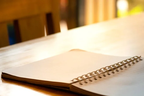 opened blank paper notebook.paper notebook on wooden desk.paper