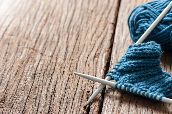 Blue knitting wool and knitting needles, knitting equipment