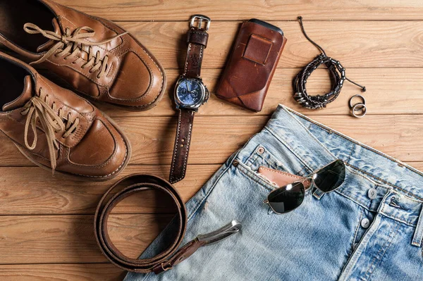 men's accessories outfit on old wood background